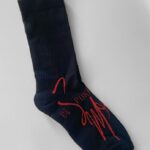 Black socks with red branding