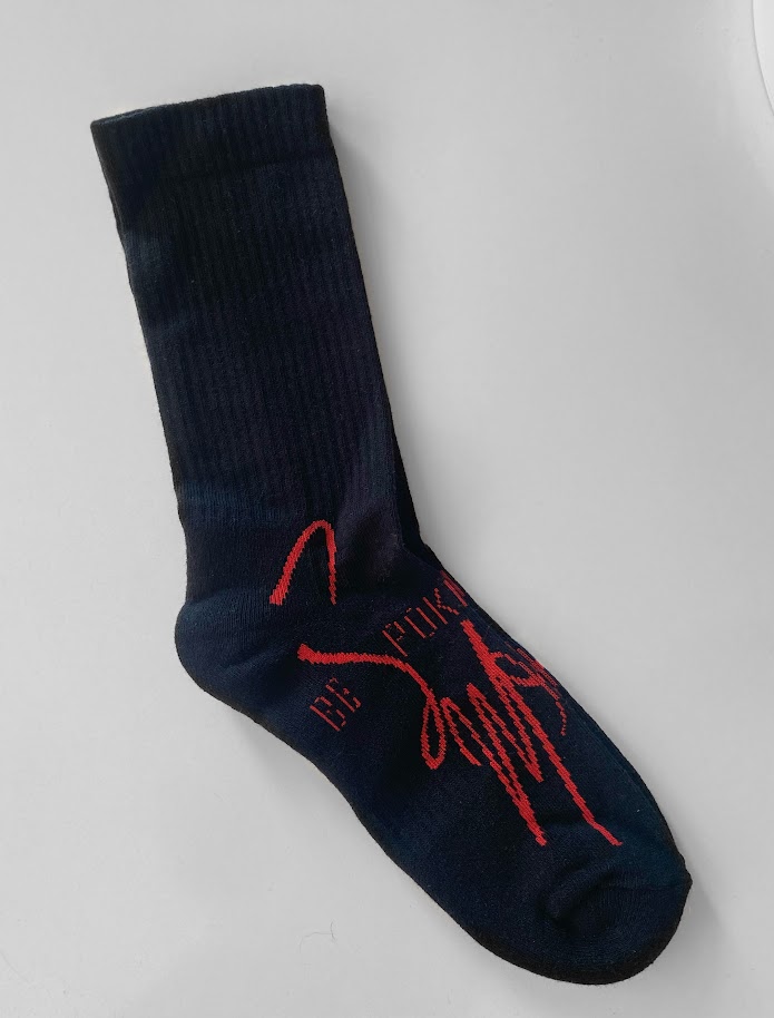 Black socks with red branding